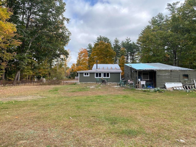 back of house with a lawn