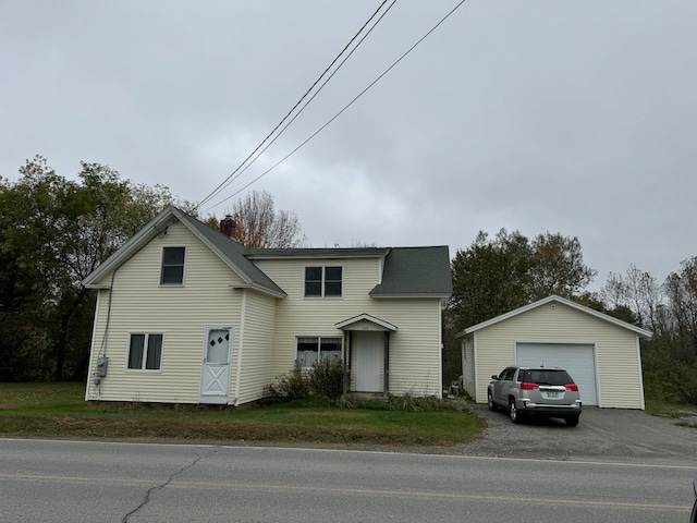 front of property featuring an outdoor structure and a garage