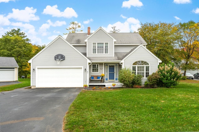 view of front facade with a garage and a front lawn