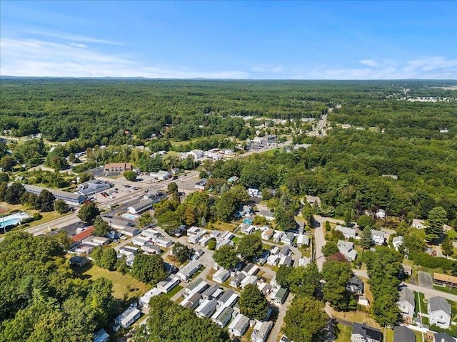 bird's eye view featuring a wooded view