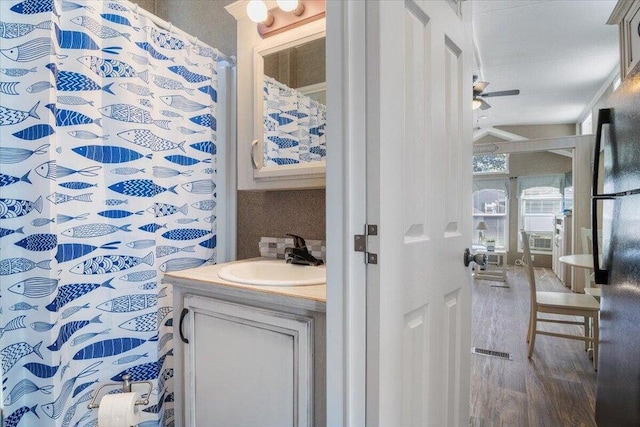 bathroom featuring vanity, hardwood / wood-style floors, and ceiling fan