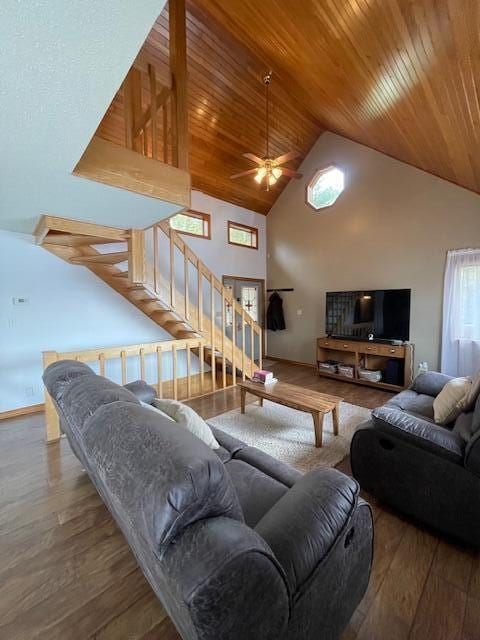 living room with wooden ceiling, hardwood / wood-style floors, ceiling fan, and high vaulted ceiling