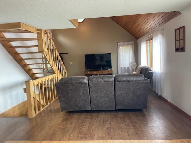 living room featuring wood ceiling, lofted ceiling, and dark hardwood / wood-style floors