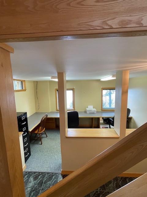 interior space with built in desk and a wealth of natural light