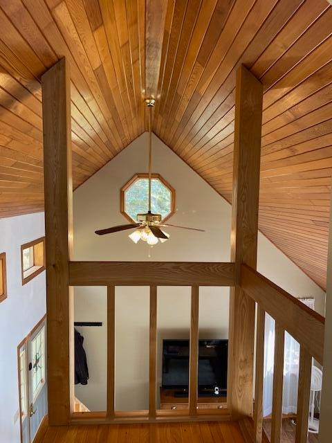 interior details with wood-type flooring, wood ceiling, and ceiling fan