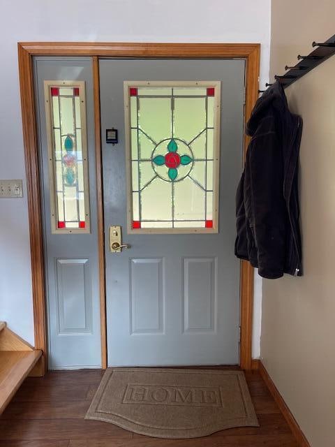 doorway with hardwood / wood-style floors