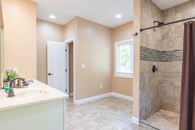 bathroom with a shower with curtain and vanity