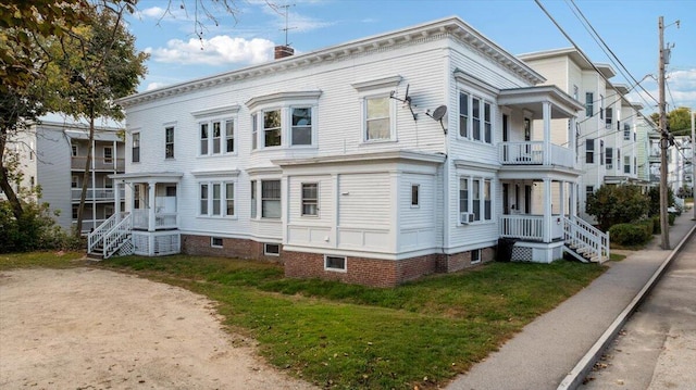 view of front of house featuring a balcony