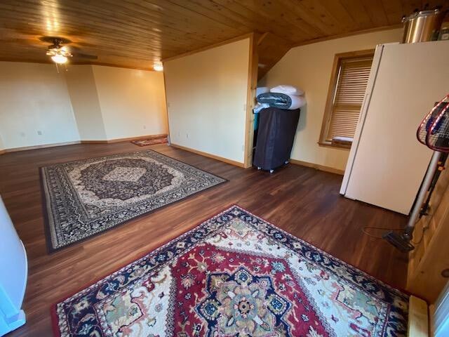 interior space featuring ceiling fan, dark wood-type flooring, and wood ceiling