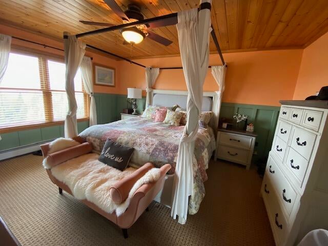 carpeted bedroom featuring crown molding, ceiling fan, and wood ceiling