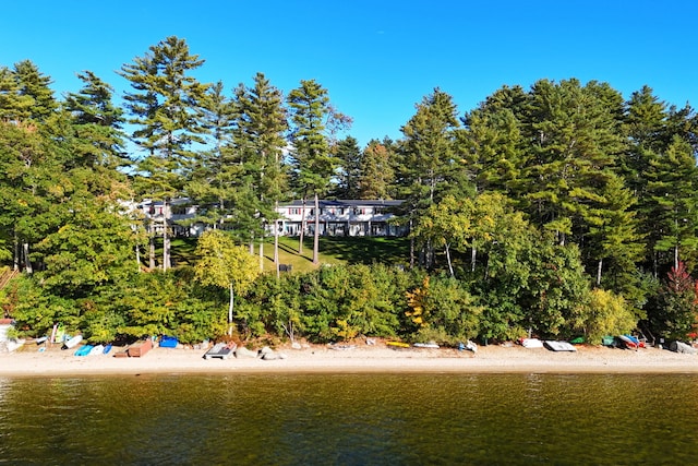 back of house with a water view