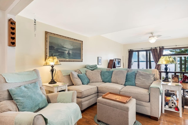 living room featuring ceiling fan and wood-type flooring