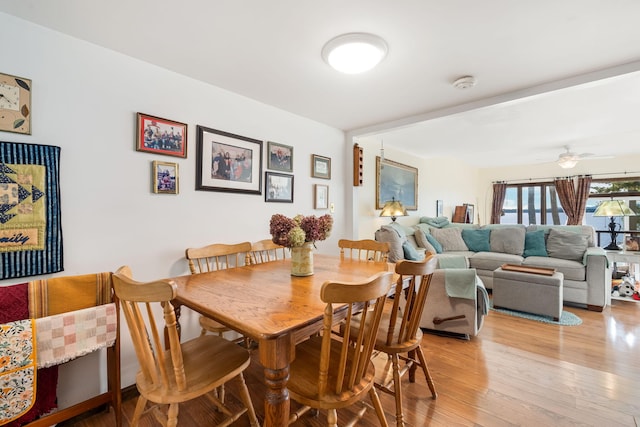 dining room featuring light hardwood / wood-style floors and ceiling fan