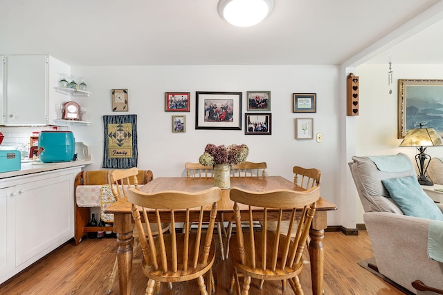 dining room with light wood-type flooring