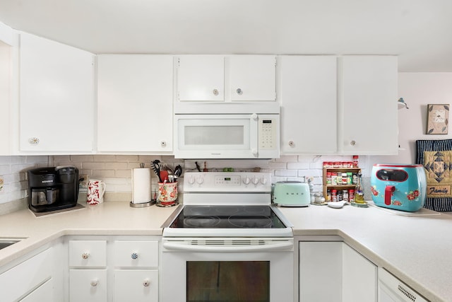 kitchen with white cabinets, white appliances, and backsplash