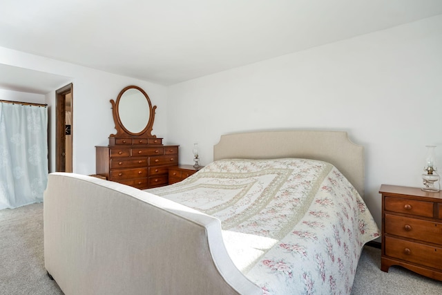 bedroom featuring light colored carpet