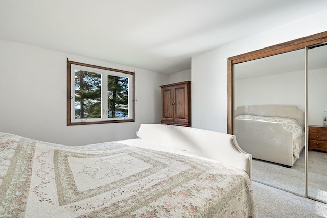 carpeted bedroom with a closet