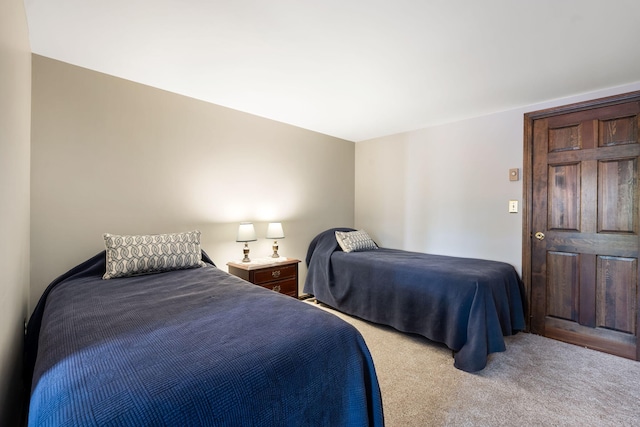 bedroom featuring light colored carpet