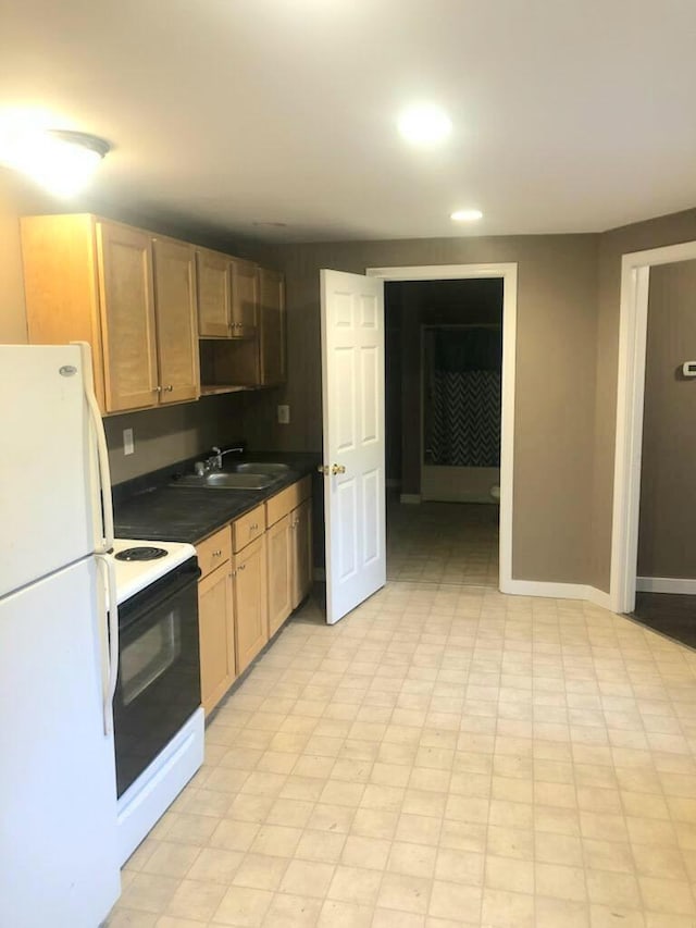 kitchen with sink and white appliances