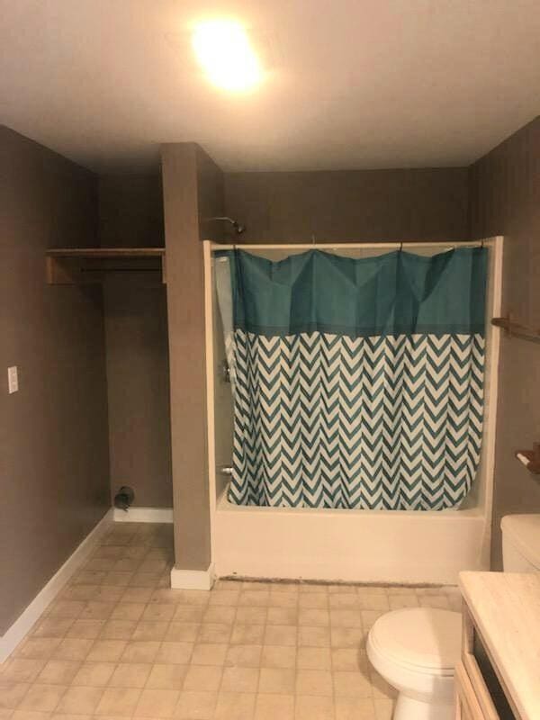 full bathroom featuring vanity, toilet, and shower / bathtub combination with curtain