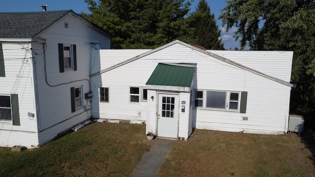 view of front of home with a front yard