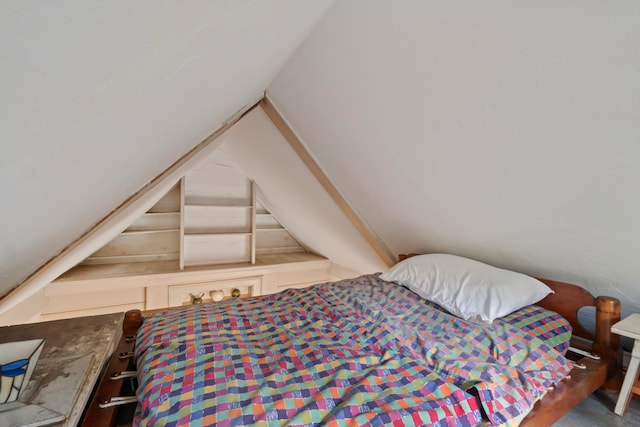 bedroom featuring vaulted ceiling