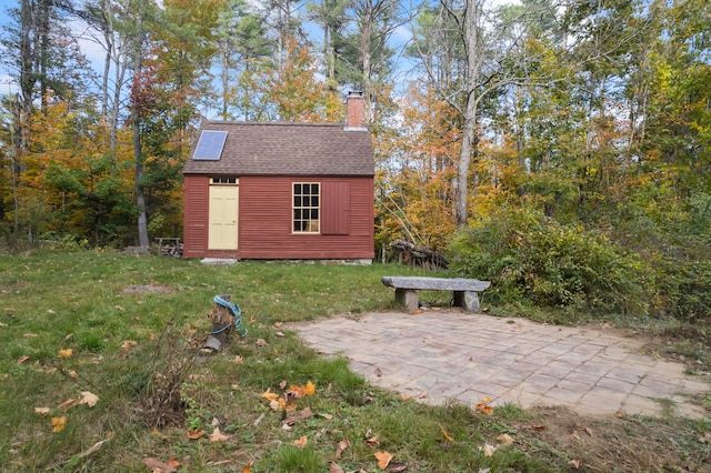 view of outdoor structure featuring a yard