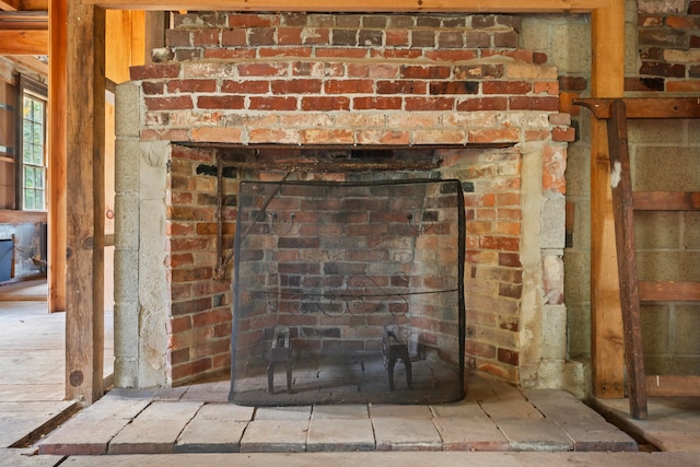 room details featuring a brick fireplace