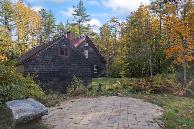 view of property exterior featuring a patio area