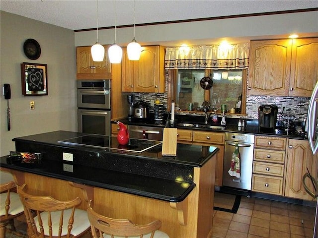 kitchen featuring double oven, tasteful backsplash, a breakfast bar, a center island, and black electric stovetop