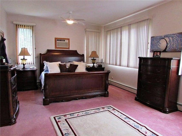 carpeted bedroom featuring ceiling fan, baseboard heating, and a wall mounted air conditioner