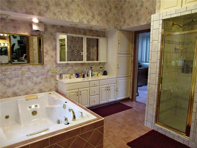 bathroom featuring a jetted tub, double vanity, wallpapered walls, a stall shower, and tile patterned flooring