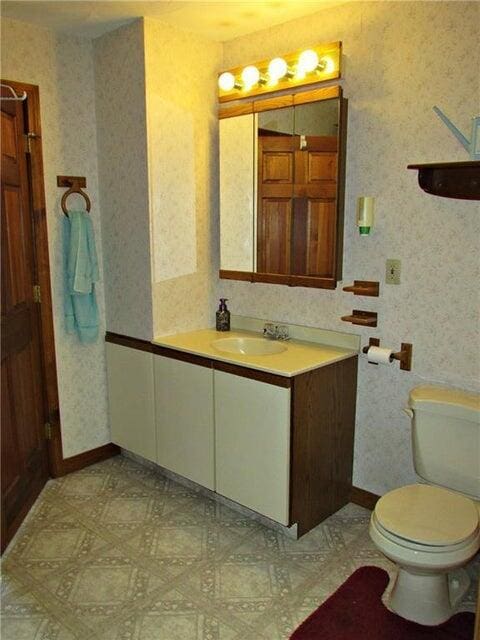 bathroom featuring vanity and toilet