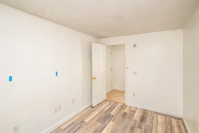 spare room with light wood-type flooring