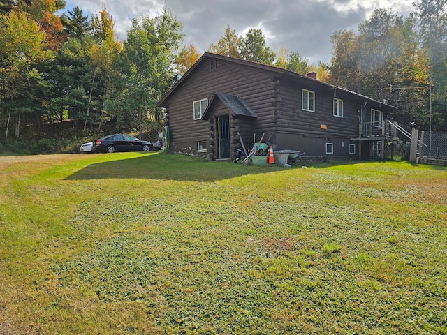 view of home's exterior with a yard