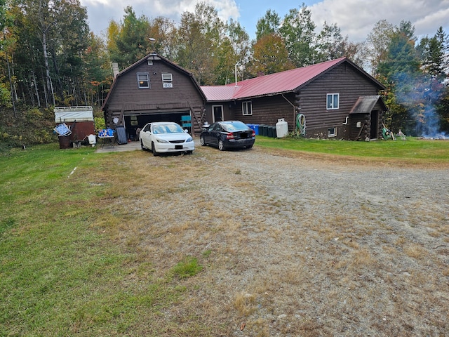 exterior space featuring a front lawn and a garage