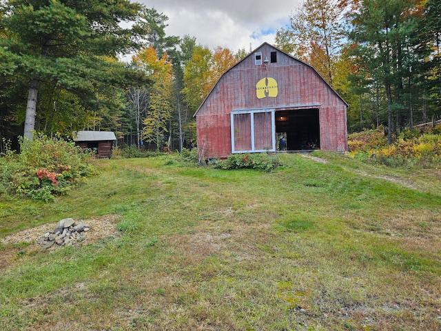 view of outbuilding with a lawn