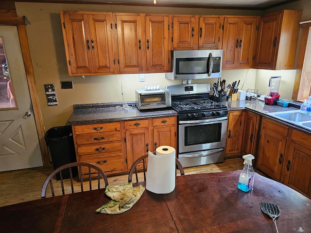 kitchen with appliances with stainless steel finishes and sink