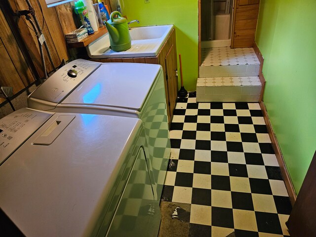 clothes washing area featuring sink and independent washer and dryer