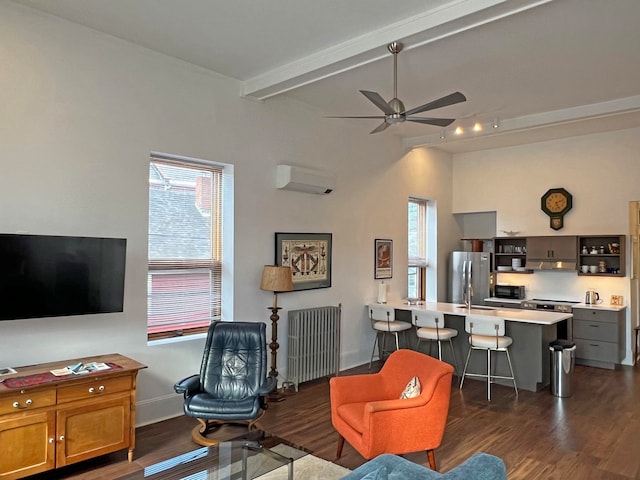 30 Water St, Ellsworth, ME 04605 - living room with vaulted ceiling with beams, radiator heating unit, ceiling fan, a wall unit AC, and dark hardwood / wood-style floors