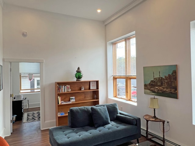 30 Water St, Ellsworth, ME 04605 - living area featuring dark wood-type flooring and a baseboard radiator