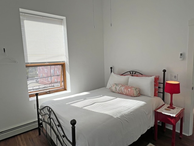 30 Water St, Ellsworth, ME 04605 - bedroom with dark wood-type flooring and a baseboard heating unit