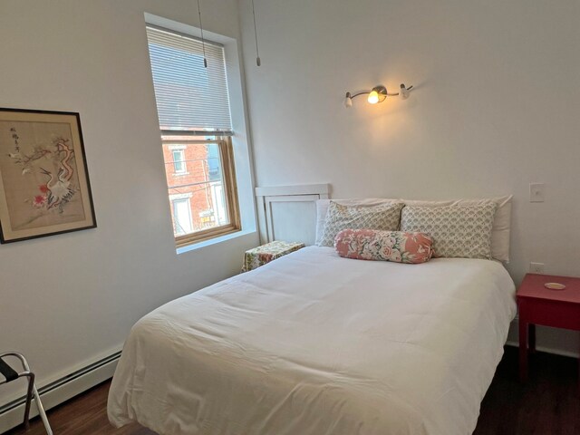 30 Water St, Ellsworth, ME 04605 - bedroom featuring a baseboard heating unit and dark hardwood / wood-style floors