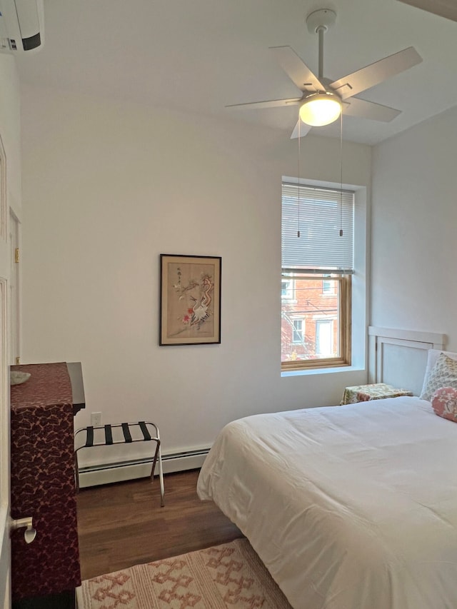 30 Water St, Ellsworth, ME 04605 - bedroom with a baseboard heating unit, dark hardwood / wood-style floors, and ceiling fan