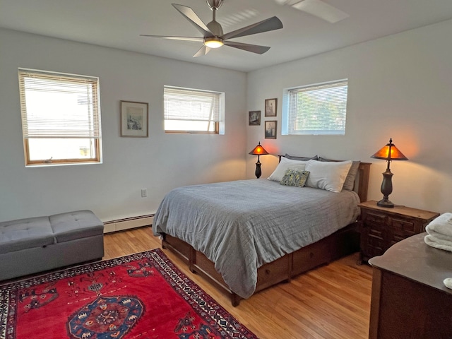 30 Water St, Ellsworth, ME 04605 - bedroom with baseboard heating, light wood-type flooring, and ceiling fan
