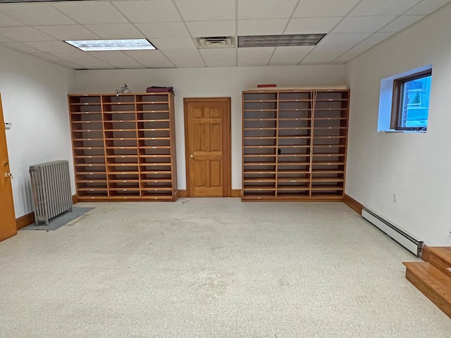 30 Water St, Ellsworth, ME 04605 - basement featuring carpet, a baseboard heating unit, and radiator