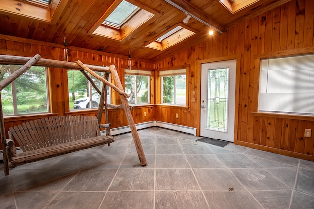 workout room with wooden walls, wood ceiling, lofted ceiling, and a healthy amount of sunlight