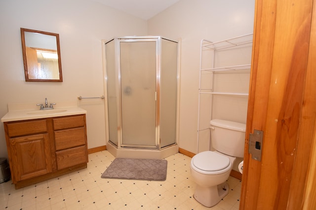 bathroom with walk in shower, vanity, and toilet