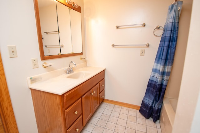 bathroom with shower / bath combination with curtain, vanity, and tile patterned floors