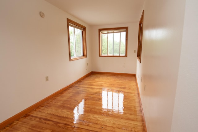 unfurnished room featuring light hardwood / wood-style flooring